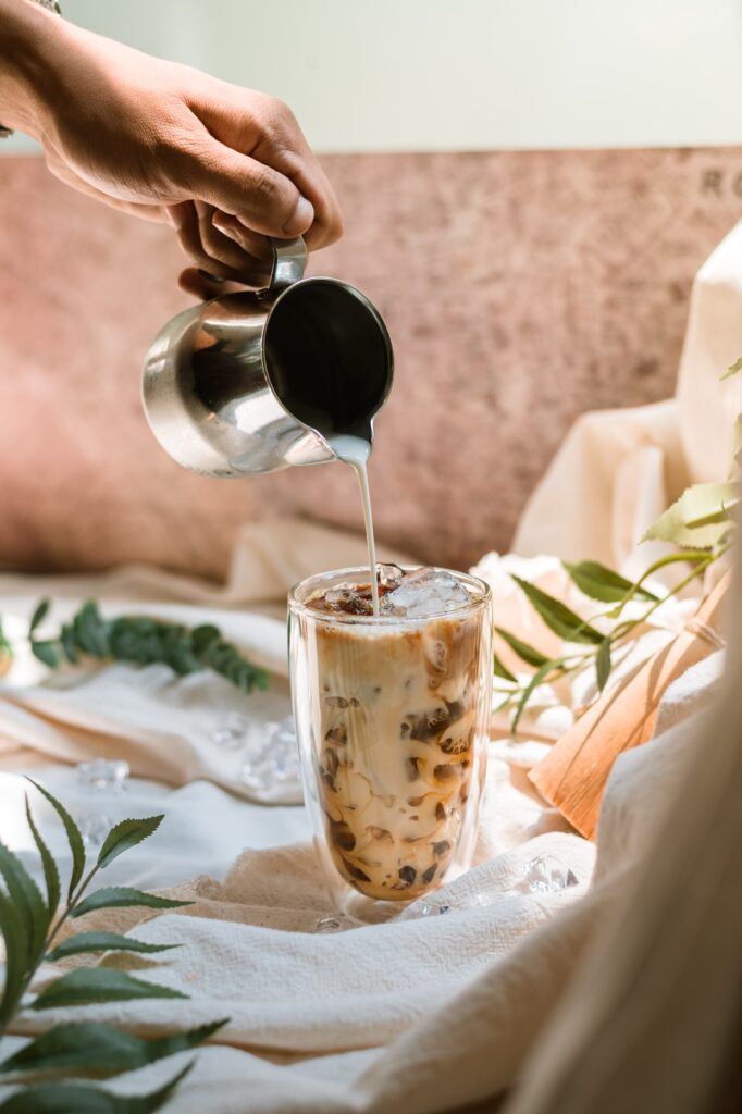 Pouring milk into iced blonde vanilla latte