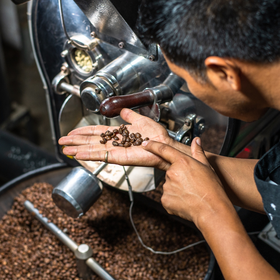 Picture of an roasting coffee beans. Understanding The Relationship Between Roast Level and Coffee Acidity
